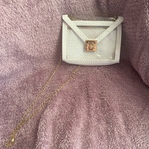 white purse w gold accents and removable wallet
